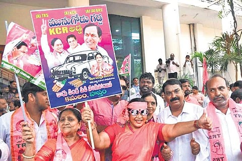 TRS workers dance at Telangana Bhavan in Hyderabad on Sunday after the party’s victory in Munugode byelection