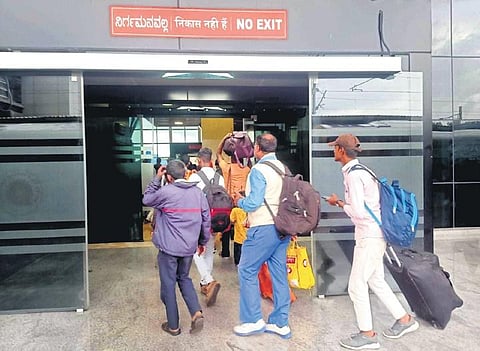(Top) There are only two entry and exit doors, all positioned along the sole entry point; an empty help desk with no staffer posted by the Railways | Express