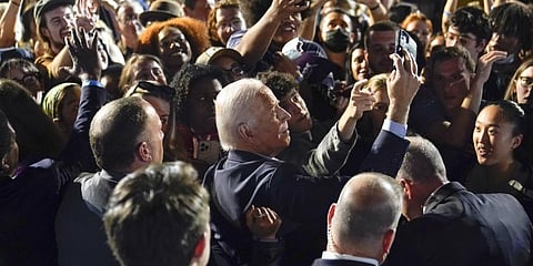 President Joe Biden takes photos with people in the crowd after speaking at a campaign event in New York.(Photo | AP)