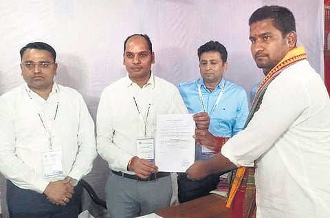 Suryabanshi receiving winning certificate from the election officer | Express