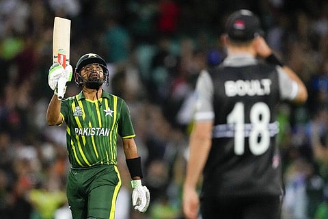 Pakistan skipper Babar Azam gestures with his bat after scoring a half century during the T20 World Cup cricket semifinal in Sydney, Nov. 9, 2022.