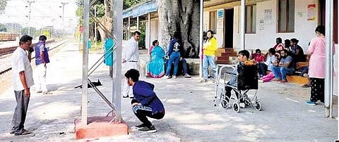 ​  Persons with disabilities at K Gollahalli Railway Station, after they were allowed in following an argument.  ​
