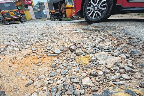 Motorists navigating a ruined Kaithamukku-Punnapuram Road. (Photo | B P Deepu, EPS)
