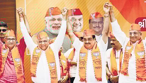 Gujarat Chief Minister and BJP candidate Bhupendra Patel with party’s state president CR Patil and other leaders in Gandhinagar on Thursday. (Photo| PTI)