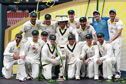 The Australian team pose with their trophy after their 2-0 test series win over the West Indies in Adelaide, Nov. 11, 2022. (Photo | AP)