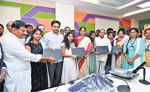 Ministers KT Rama Rao, Sabitha Indra Reddy and A Indrakaran Reddy distribute laptops to the students of IIIT-Basara in Nirmal district on Saturday. (File Photo)
