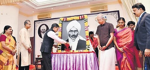 Governor RN Ravi along with Bharathiyar’s grandson Rajkumar Bharathi paying tributes to the portrait of the freedom fighter at Raj Bhavan on Sunday | Express