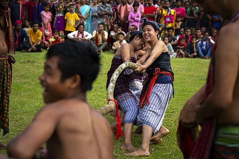 No political tug of war this: Rabha tribal women take part in a tug of war competition with men during Baikho festival at a village along the Assam Meghalaya border, June 4, 2022. ( File Photo | AP)