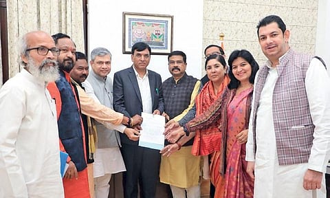BJP MPs from the state led by Union Minister Dharmendra Pradhan submitting the memorandum to  Union Health Minister Mansukh Mandaviya in New Delhi
