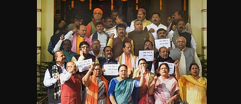 Bharatiya Janata Party legislators stage a protest over Saran hooch tragedy, during the Winter Session of the state Assembly, in Patna. (Photo | PTI)