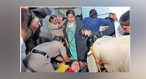 Mayor Arya Rajendran makes her way through the protesting BJP councillors, demanding her resignation in connection with the letter row, at the Corporation office in capital | Express photo
