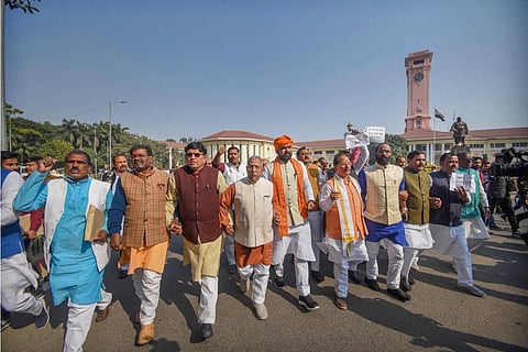 Leader of Opposition in Bihar Assembly and BJP leader Vijay Kumar Sinha with legislators shouts slogans during a protest against Bihar government over the Chhapra Hooch tragedy. (Photo | PTI)