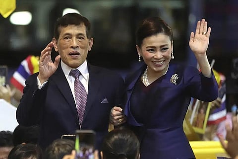 Thai King Maha Vajiralongkorn and Queen Suthida wave to supporters after presiding over the opening of a new mass transit station in Bangkok, Thailand on Nov. 14, 2020. (File Photo | AP)