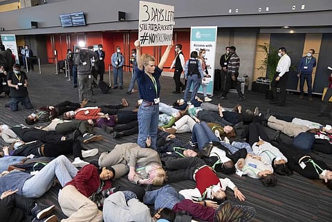 Members of the Global Youth Biodiversity Network demonstrate in the halls of the convention center at the COP15 UN conference on biodiversity in Montreal, Dec. 16, 2022. (Photo | AP)