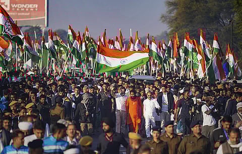 Congress leader Rahul Gandhi waves at supporters during the party's 'Bharat Jodo Yatra', in Dausa. (Photo |PTI)