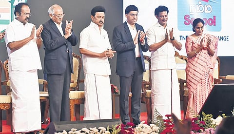 Chief Minister MK Stalin launching the logo of Namma School Foundation as Venu Srinivasan and Viswanathan Anand look on | Express