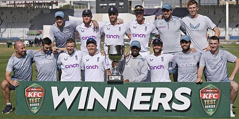 England's players pose for photograph with the trophy after winning the third test and series against Pakistan, in Karachi, Pakistan, Tuesday, Dec. 20, 2022.(Photo | AP)