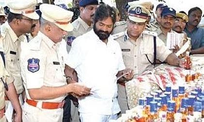 Excise Minister V Srinivas Goud inspects the spurious liquor seized by Hayatnagar Excise police on Tuesday