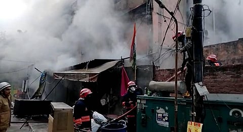 A major fire which broke out at a shop at DDA Lal market in Vikaspuri area of New Delhi. (Photo | PTI)