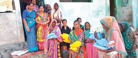 Members of women SHGs and elected representatives distributing essential nutrients including ‘chhatua’ to beneficiaries in Sanakhemundi block | Express