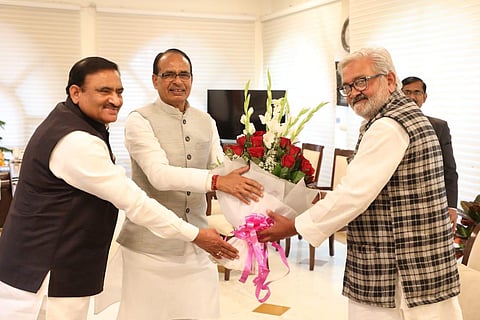 Former Congress leader Brij Bihari Pateriya, (R), joins the BJP in the presence of Madhya Pradesh CM Shivraj Singh Chouhan in Bhopal. (Photo | IANS)