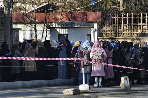 Afghan women students queue at one of Kabul University's gates in Kabul, Afghanistan, on Feb. 26, 2022. (File Photo | AP)
