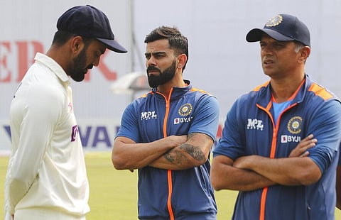 India's captain KL Rahul, Virat Kohli, and coach Rahul Dravid, (From L to R), talk after winning the second test match against Bangladesh, in Dhaka, Dec. 25, 2022. (Photo | AP)