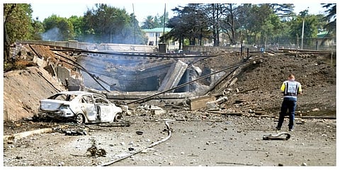 A burned out vehicle marks the spot where a gas tanker exploded under a bridge in Boksburg, east of Johannesburg. (Photo | AP)