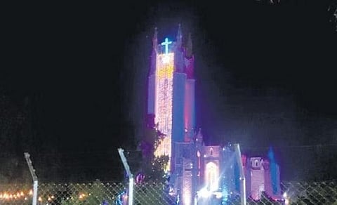 A view of the Medak church illuminated with bright lights on Christmas eve
