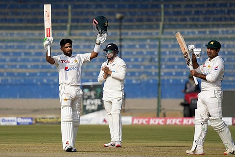 Pakistan's Babar Azam (L) celebrates after scoring century during the first day of first test match between Pakistan and New Zealand, in Karachi, Dec. 26, 2022. (Photo | AP)