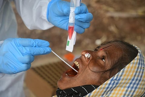 A health worker collects swab samples from a woman. (File Photo | Ashishkrishna HP, EPS)