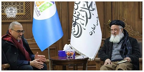 The acting head of the U.N. Mission in Afghanistan, Ramiz Alakbarov, meets with the Taliban government’s economy minister, Qari Din Mohammed Hanif. (Photo | AP)