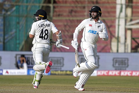 New Zealand's Devon Conway (R) and Tom Latham run between the wickets during day two of the first test match against Pakistan in Karachi, Dec. 27, 2022. (Photo | AP)