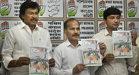 West Bengal Congress President Adhir Ranjan Chowdhury holds a poster for party's 'Bharat Jodo Yatra' in the state, during a press conferece at party office in Kolkata(Photo | PTI)