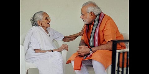 Prime Minister Narendra Modi talks to his mother Hiraba at her home in Gandhinagar. (File Photo | PTI)