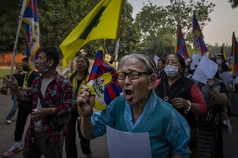 Exile Tibetan activists hold blank white papers symbolizing government censorship in China, while shouting anti-China slogans during a protest in New Delhi, India, Friday, Dec. 2, 2022. (Photo | AP)