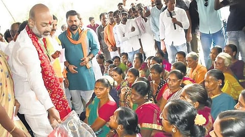 BJP State president Bandi Sanjay interacts with villagers during his padayatra in Nirmal on Friday