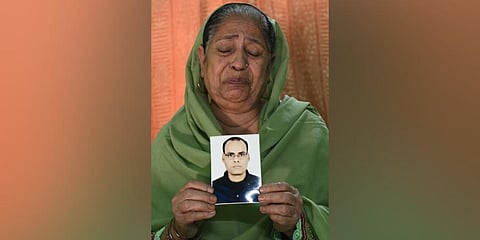 Asiya Begum, mother of the late Athar Rasheed who died after undergoing a hair transplant at a clinic. (Photo | AFP)