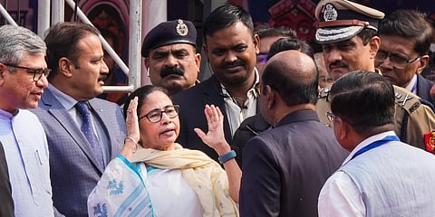 West Bengal CM Mamata Banerjee speaks with State Governor CV Ananda Bose as Railways Minister Ashwini Vaishnaw looks on, during the flagging off ceremony of Vande Bharat Express train. (Photo |PTI)