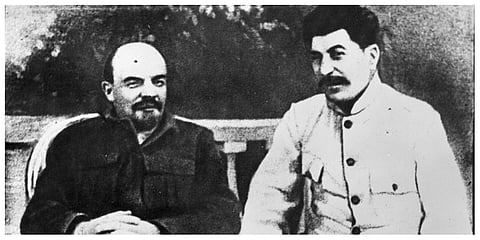 Soviet founder Vladimir Lenin, left, and Soviet leader Josef Stalin sit in a park at Gorki residence in 1922 just outside Moscow, Russia. (File photo | AP)