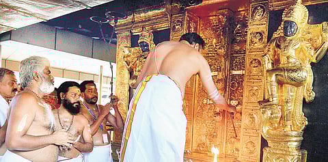 Thantri Kandararu Rajeevaru opening the sreekovil of Sabarimala temple for the Makaravilakku season on Friday