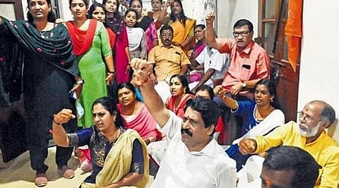 BJP councillors protesting in front of offices of Thiruvananthapuram Corporation Mayor Arya Rajendran and Works Standing Committee chairman D R Anil demanding the resignation of the mayor.