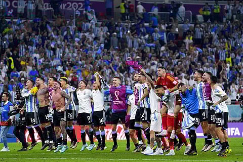 Argentina's players celebrate winning the World Cup round of 16 soccer match between Argentina and Australia at the Ahmad Bin Ali Stadium in Doha, Qatar | AP