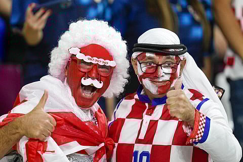Croatia and Canada fans cheer ahead of the World Cup group F soccer match between Croatia and Canada, at the Khalifa International Stadium in Doha, Qatar | AP