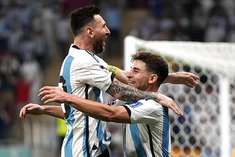 Argentina's Julian Alvarez, right, and Lionel Messi, left, celebrate their side's second goal during the World Cup round of 16 soccer match | AP