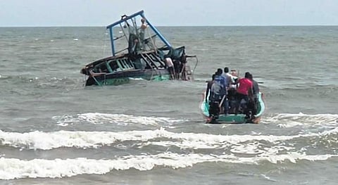 Fishers rush to recover mechanized boat capsized at sea near Poompuhar fishing harbour on Saturday | Express