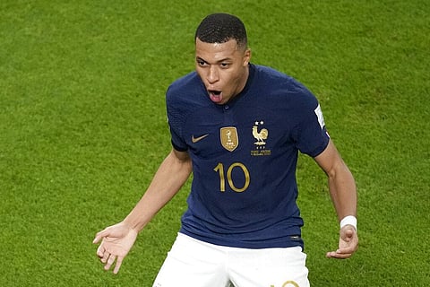 Kylian Mbappe celebrates after scoring his side's second goal during the World Cup round of 16 fixture between France and Poland, at the Al Thumama Stadium in Doha, Dec. 4, 2022. (Photo | AP)
