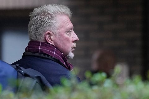 Boris Becker looks back as he waits in a queue to get into Southwark Crown Court in London, March 2022. ( Photo | AP)