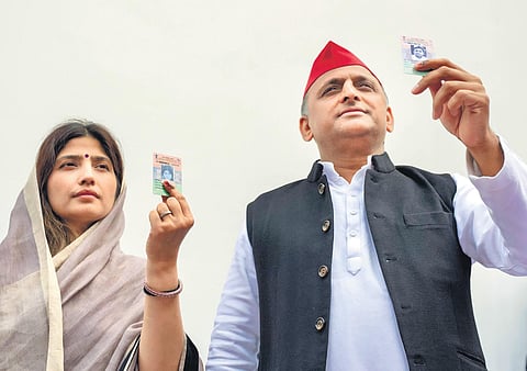 SP president Akhilesh Yadav and his wife and party candidate Dimple Yadav after casting their votes at Saifai in Etawah district on  Monday | PTI