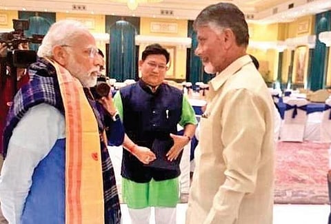 TDP chief and Andhra Pradesh Leader of Opposition N Chandrababu Naidu speaks with PM Narendra Modi ahead of the G-20 preparatory meeeting in New Delhi on Monday